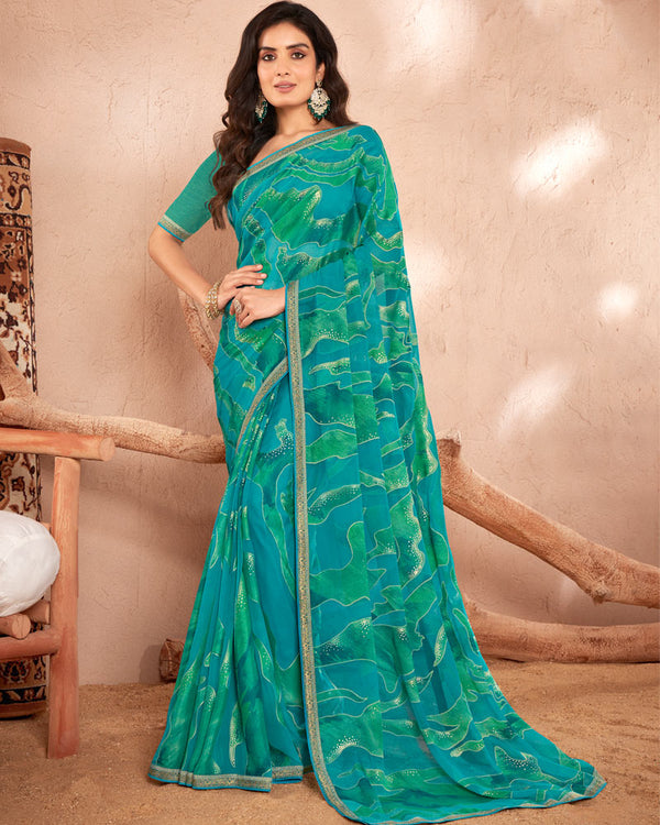 Vishal Prints Teal Blue Printed Chiffon Brasso Saree With Foil Print And Border