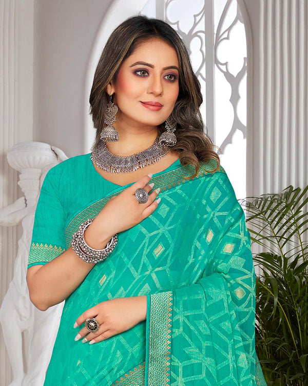 Vishal Prints Aqua Green Brasso Saree With Foil Print And Zari Border